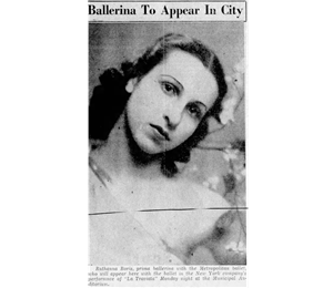 A newspaper clipping says Ballerina to Appear in City above a photograph of a young woman in a ballet costume with her head titled to one side. 